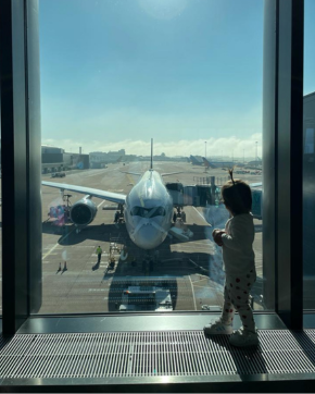 Toddler looking at Airplane 